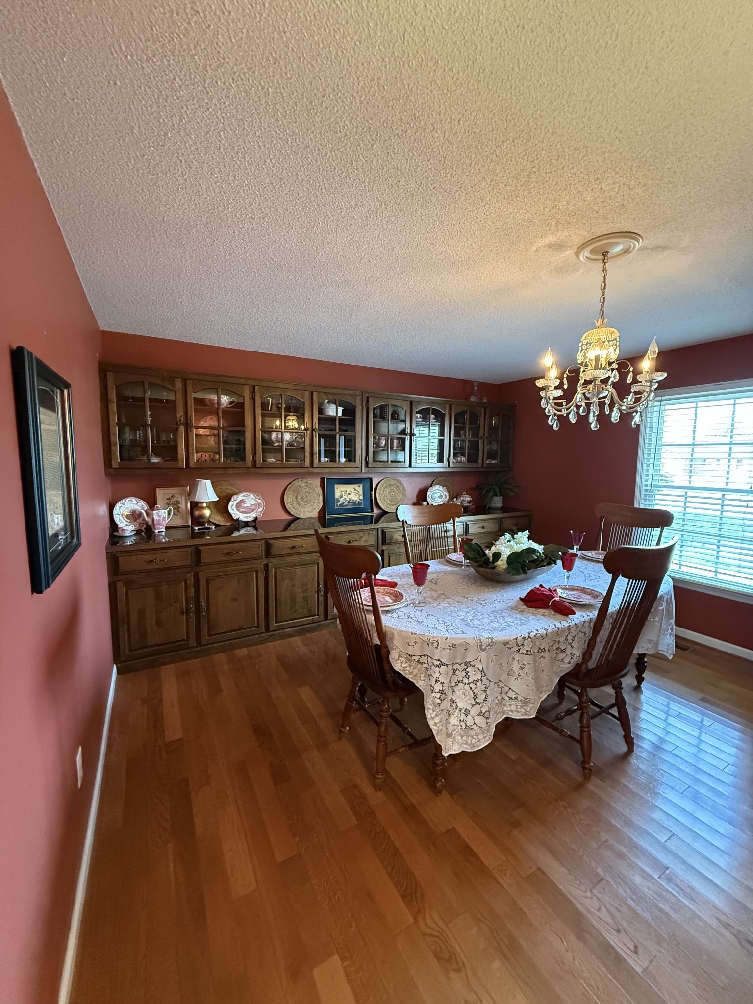 405 Robins Street Lawrenceburg, TN 38464 - Photo 9 of 65 a living room with furniture couches and a dining table with wooden floor