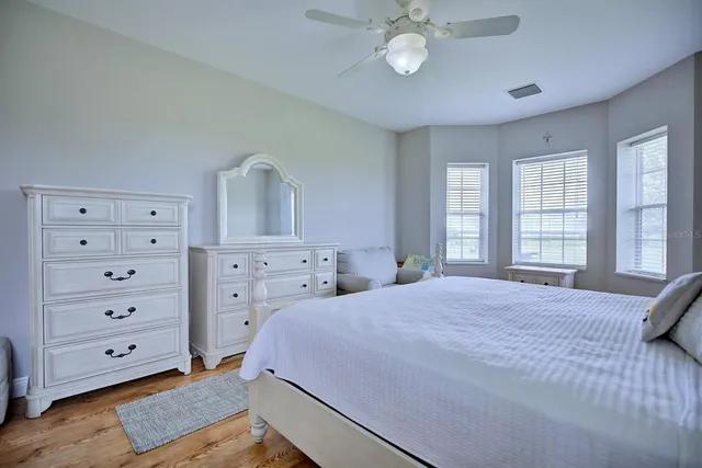 a view of walk in closet with clothes