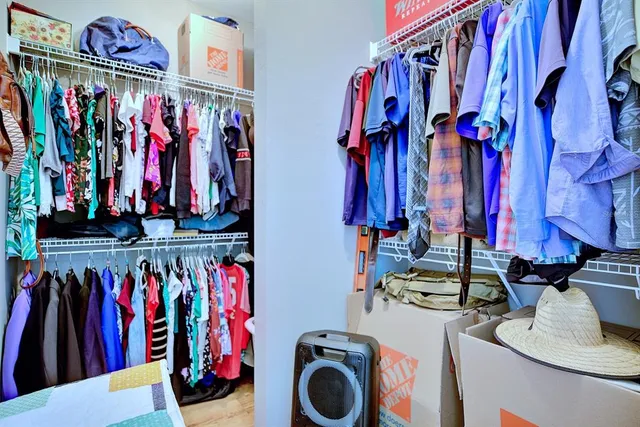 a bathroom with a bathtub a double vanity sink and mirror