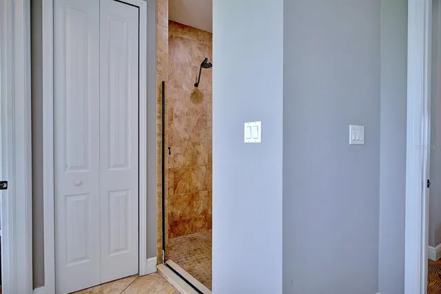 a kitchen with a table chairs stove and kitchen view