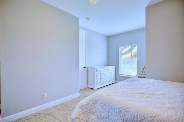 a bathroom with a sink vanity and a toilet