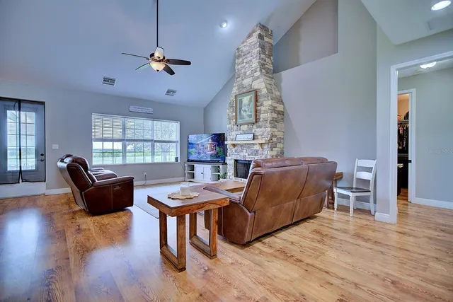 a living room with furniture and a window