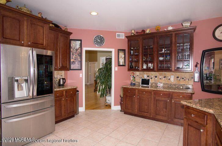 467 Leesville Road Jackson, NJ 08527 - Photo 9 of 19 a kitchen with stainless steel appliances kitchen island granite countertop a refrigerator and a stove top oven