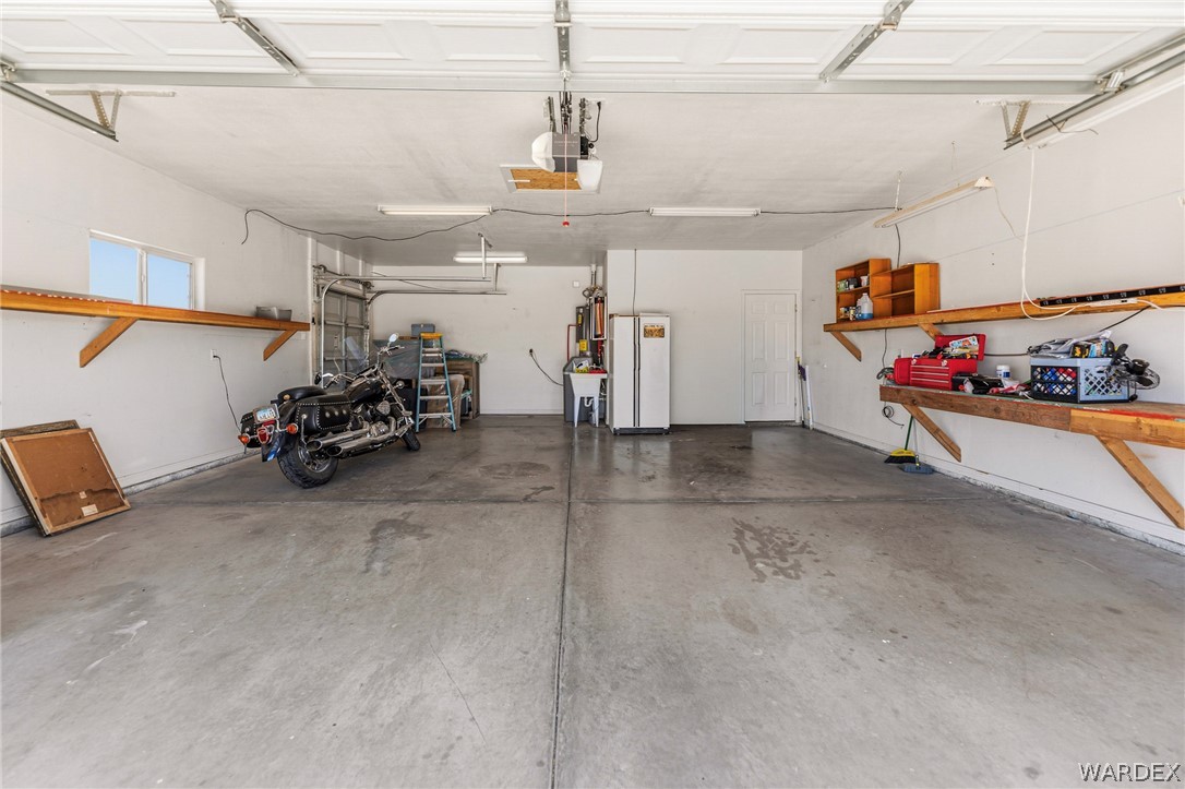 9332 Branded Road Kingman, AZ 86401 - Photo 38 of 44 a view of a garage with rack and bicycle