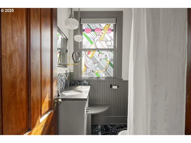 a bathroom with a sink and a mirror
