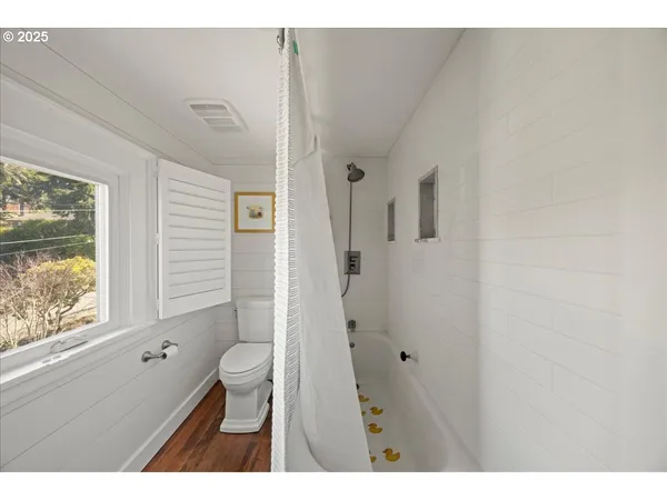 a bathroom with a toilet sink and a shower