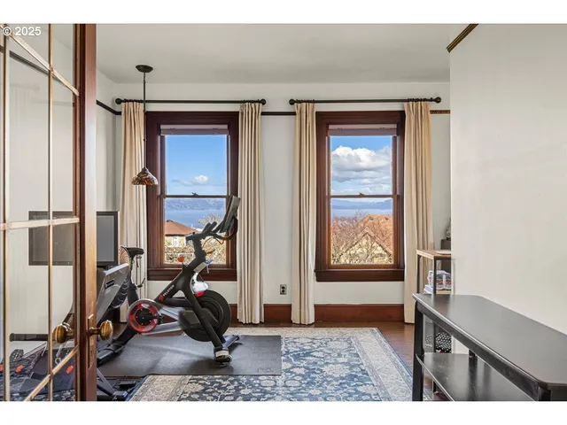 a view of an entryway with wooden floor