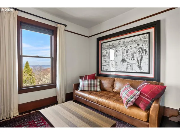 a bedroom with furniture and a window