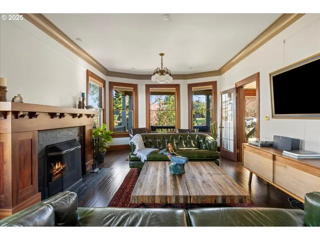 a living room with furniture fireplace and flat screen tv