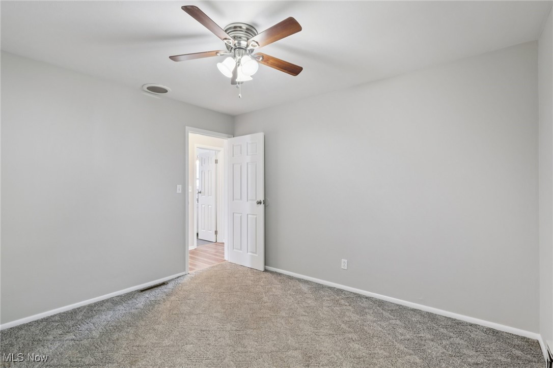 611 Wilson Street Struthers, OH 44471 - Photo 25 of 44 Unfurnished room with carpet flooring and ceiling fan