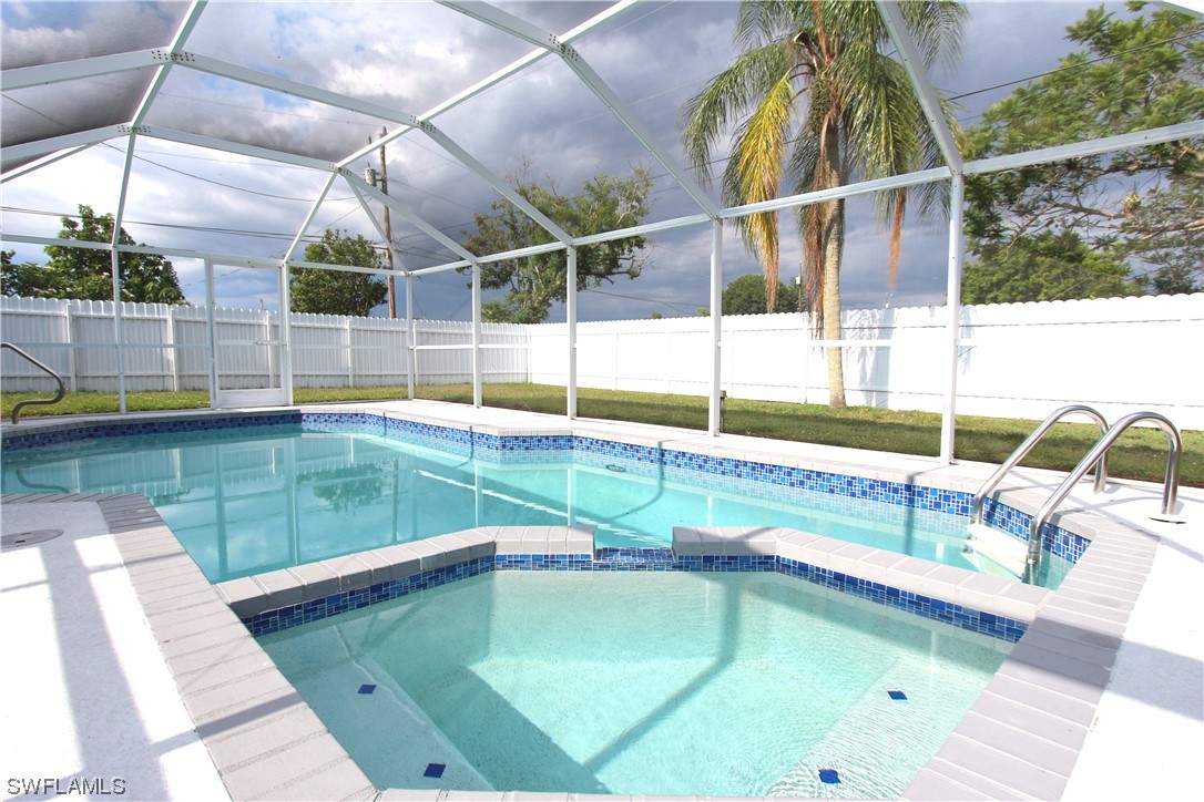 a view of a swimming pool with a patio