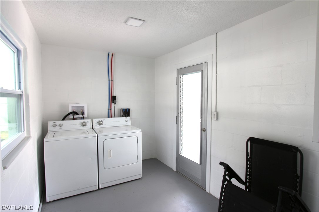 116 Oleander Road Lehigh Acres, FL 33936 - Photo 22 of 31 a utility room with dryer and washer