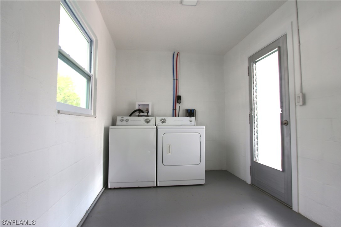 116 Oleander Road Lehigh Acres, FL 33936 - Photo 23 of 31 a utility room with dryer and washer