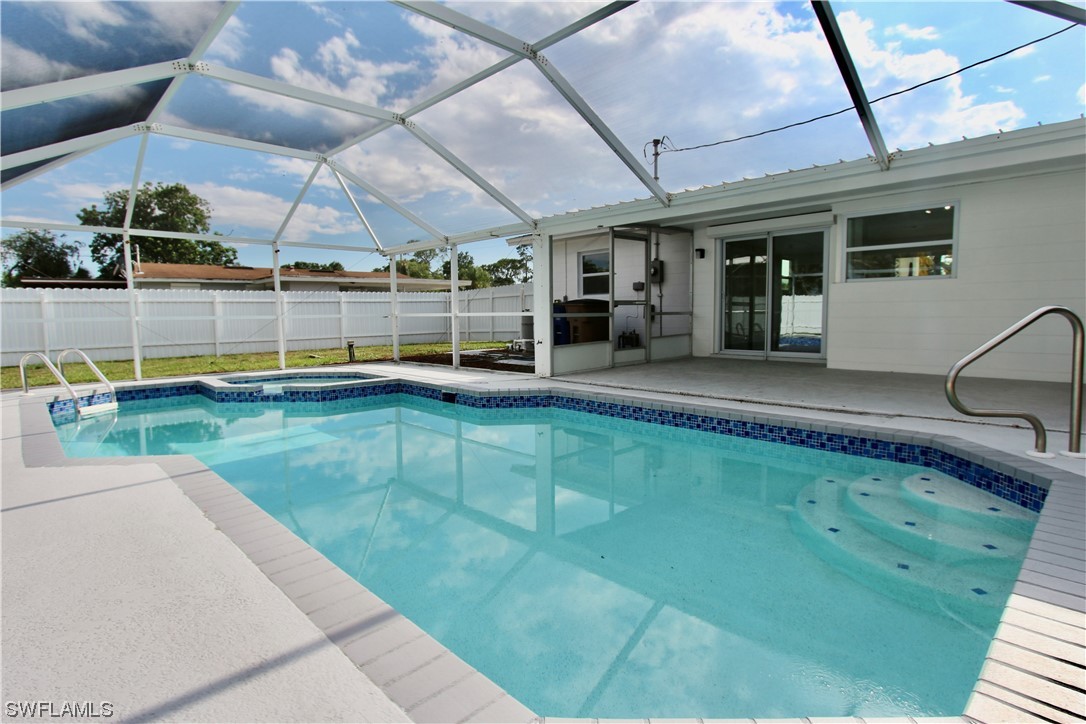 116 Oleander Road Lehigh Acres, FL 33936 - Photo 25 of 31 a swimming pool with outdoor seating