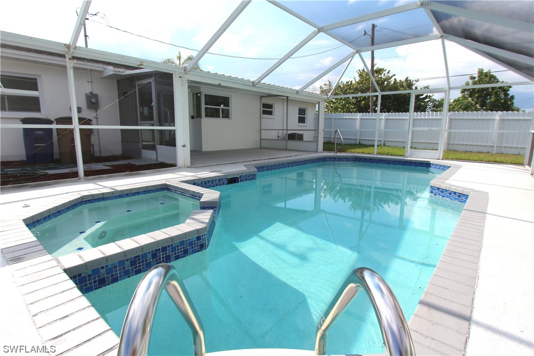 116 Oleander Road Lehigh Acres, FL 33936 - Photo 27 of 31 a view of a backyard with swimming pool