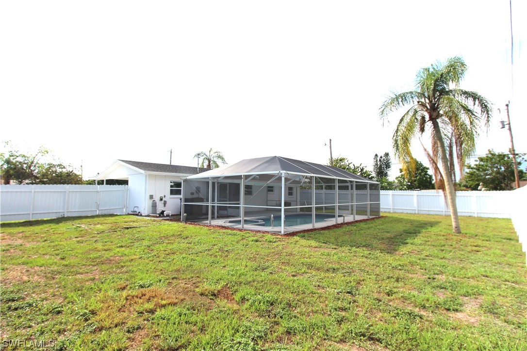 116 Oleander Road Lehigh Acres, FL 33936 - Photo 29 of 31 a view of a house with a yard and sitting area