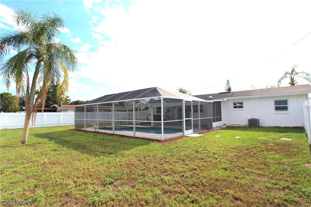 116 Oleander Road Lehigh Acres, FL 33936 - Photo 30 of 31 a view of a house with a yard and sitting area