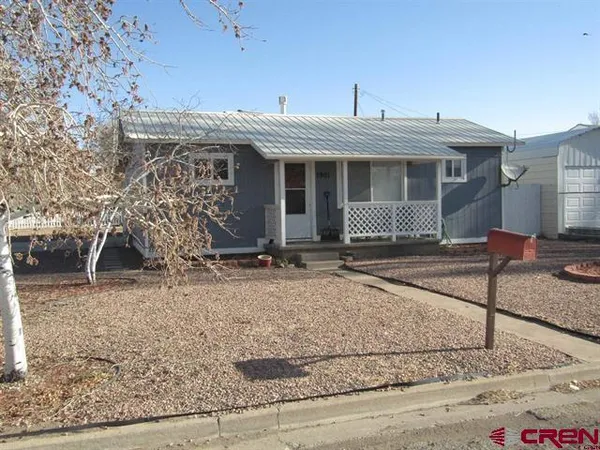 a view of a house with white walls