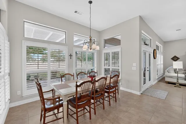 a view of a dining room with furniture window and outside view