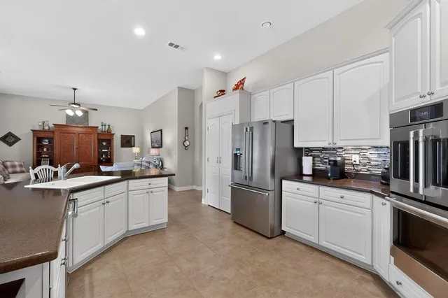a kitchen with sink cabinets and counter top space