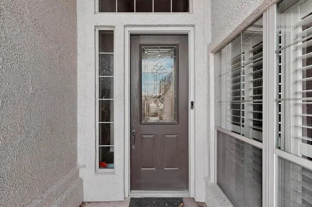 a view of an entryway with wooden floor