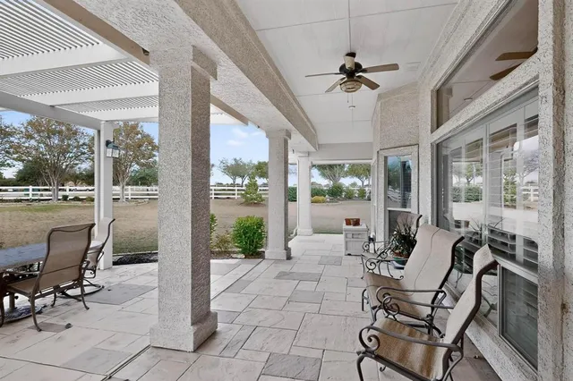 a view of a patio with a table chairs and a patio