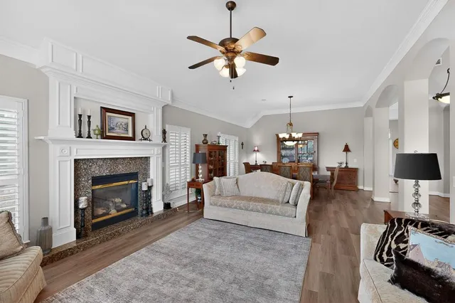 a view of a dining room with furniture wooden floor and chandelier