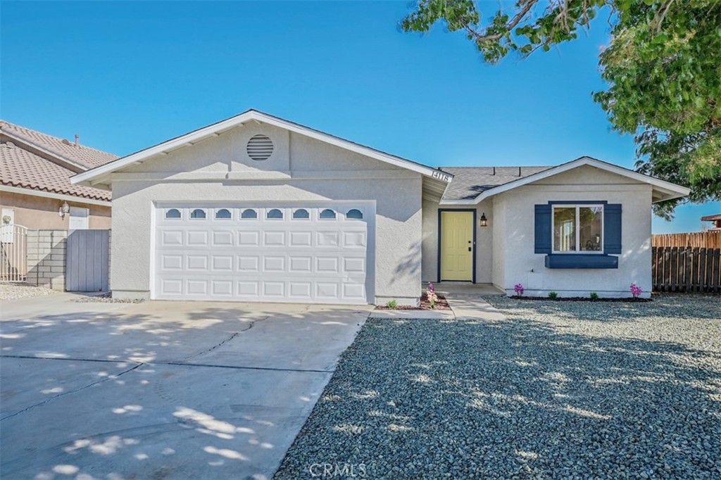 14118 Rivers Edge Road Helendale, CA 92342 - Photo 1 of 1 a front view of a house with a garden