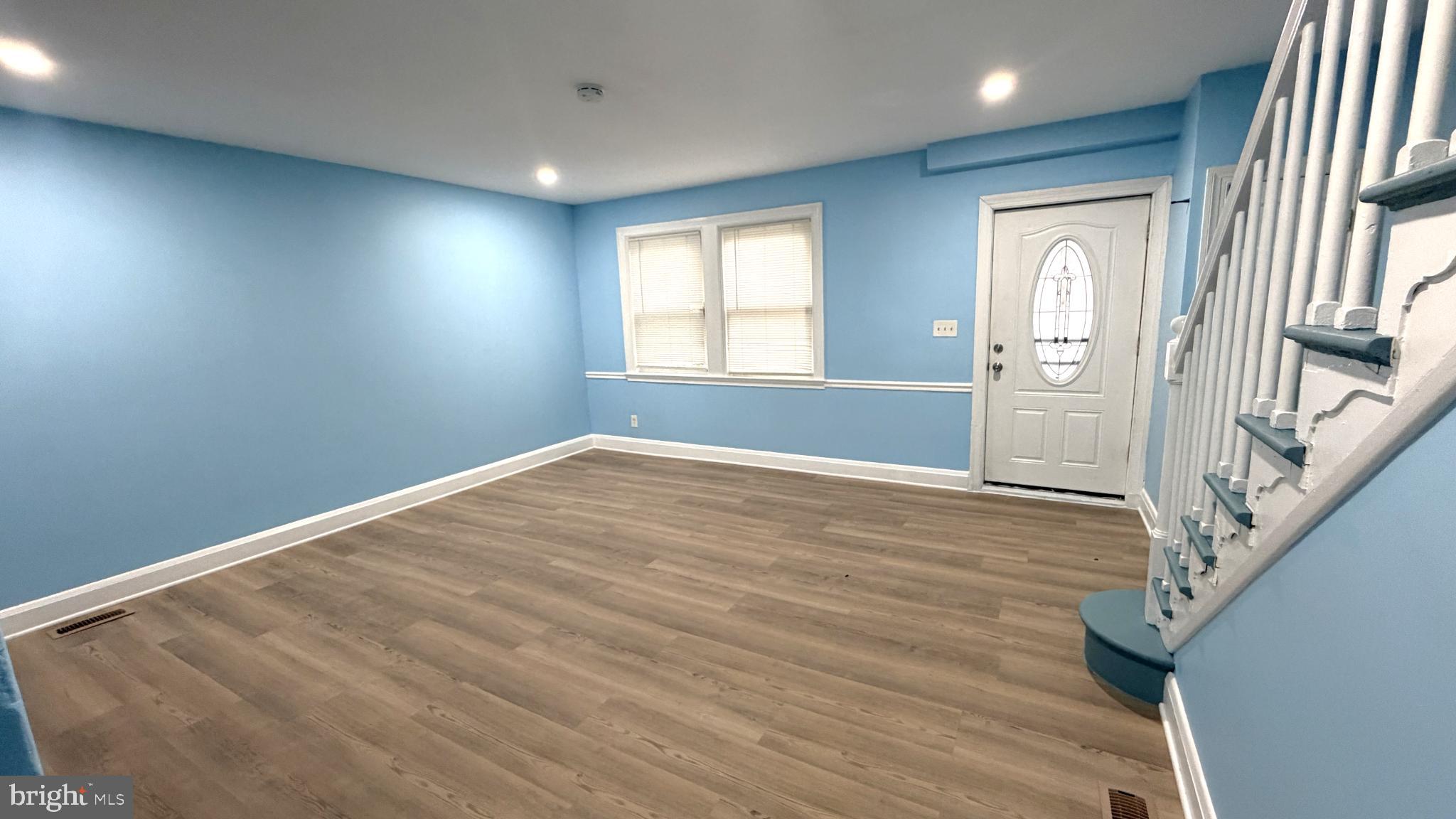 12 South Ellamont Street Baltimore, MD 21229 - Photo 11 of 26 a view of empty room with wooden floor and fan