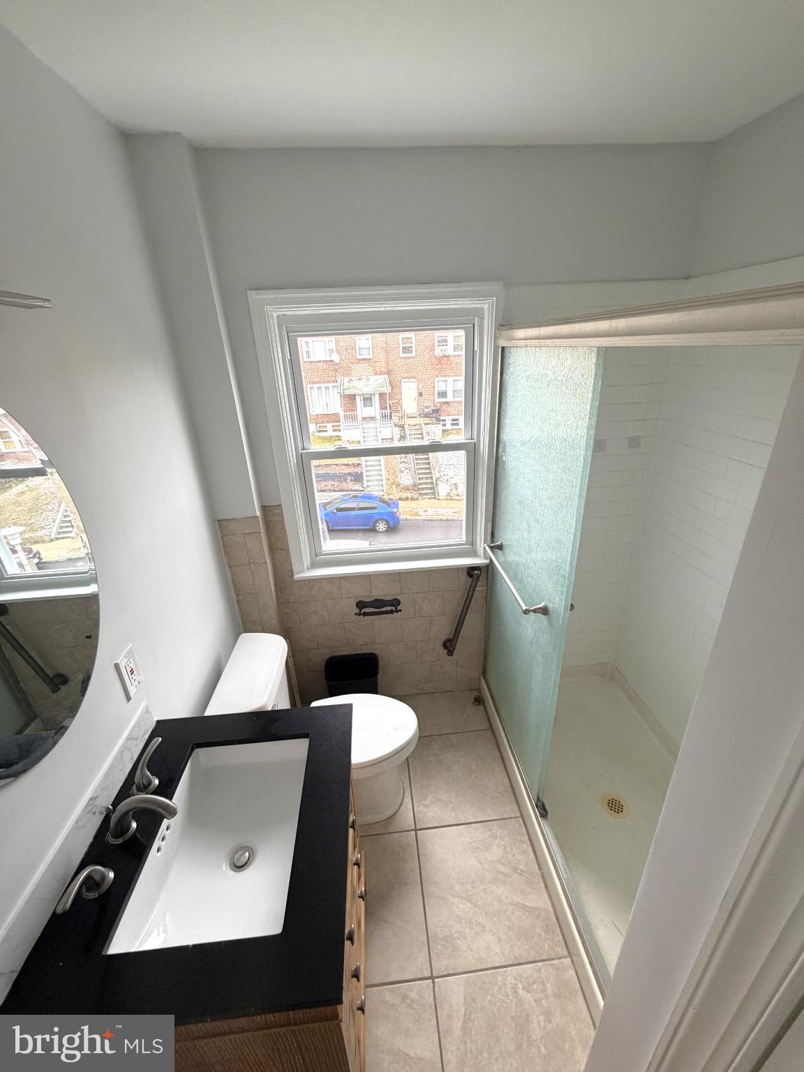 12 South Ellamont Street Baltimore, MD 21229 - Photo 16 of 26 a bathroom with a toilet sink and mirror