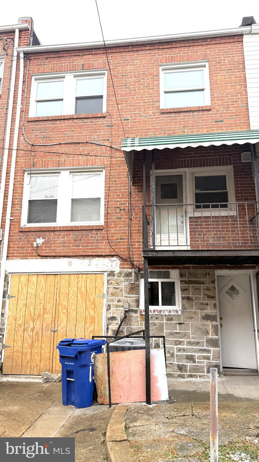 12 South Ellamont Street Baltimore, MD 21229 - Photo 24 of 26 a view of front door of house with car parked