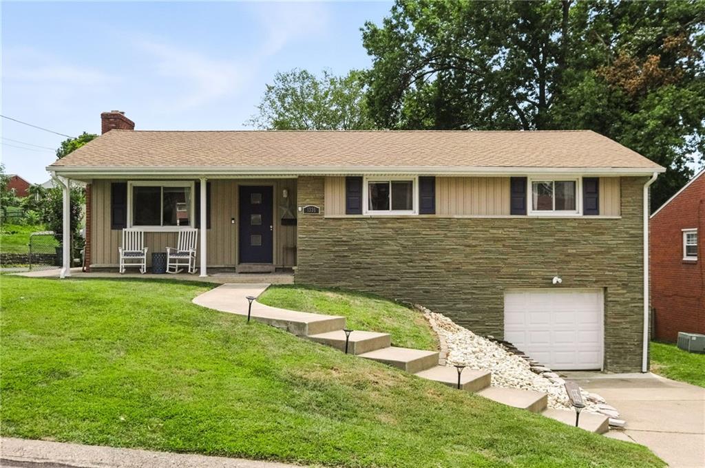 1335 Cardinal Drive Pittsburgh, PA 15243 - Photo 1 of 34 a front view of a house with a yard