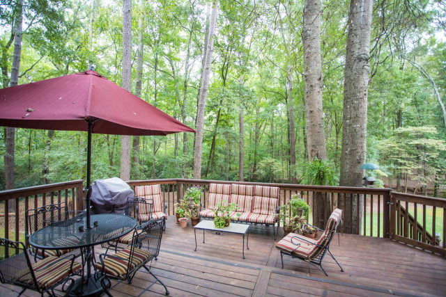 6781 Colaparchee Road Macon, GA 31210 - Photo 22 of 45 a view of a chair and table on the deck