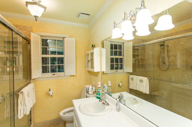 6781 Colaparchee Road Macon, GA 31210 - Photo 34 of 45 a bathroom with a sink a toilet and shower