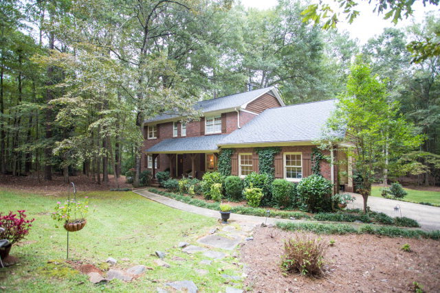 6781 Colaparchee Road Macon, GA 31210 - Photo 41 of 45 a front view of a house with a yard and trees