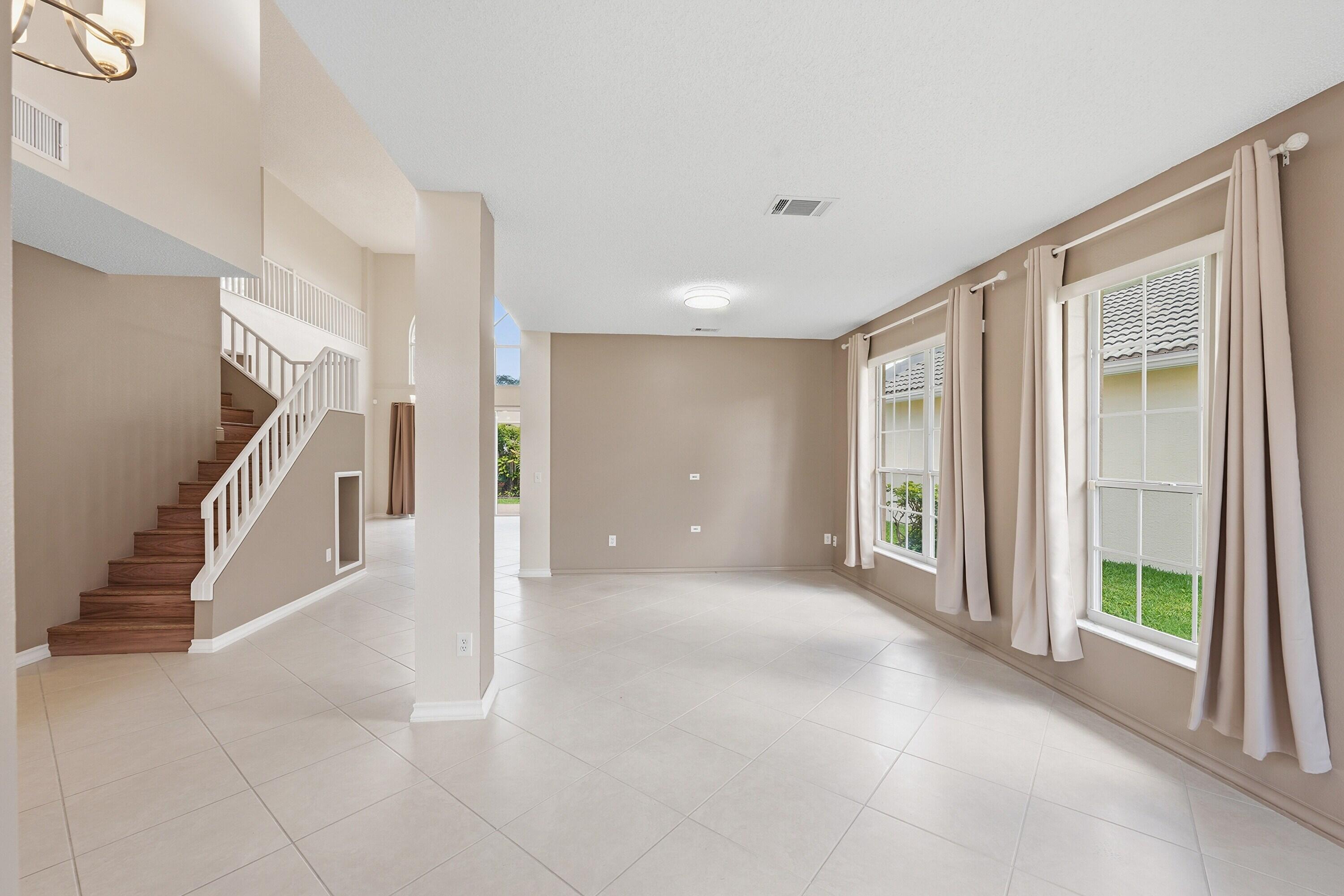 18474 Old Princeton Lane Boca Raton, FL 33498 - Photo 6 of 46 a view of a livingroom with a staircase