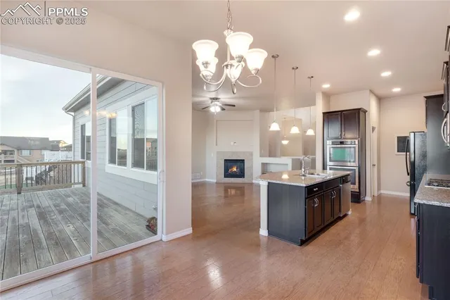 a view of a balcony with wooden floor and city view