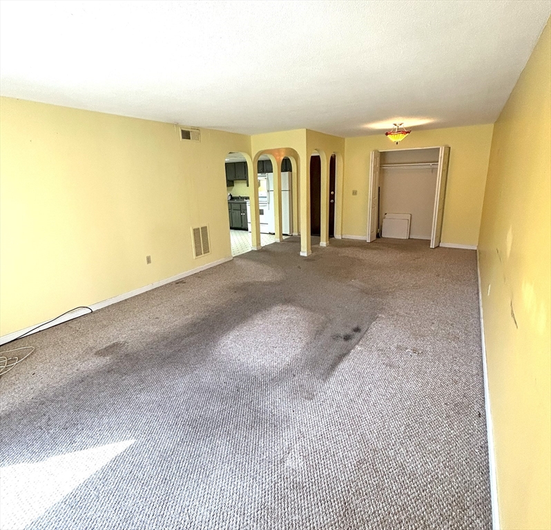 6 Shadowbrook Lane, Unit 9 Milford, MA 01757 - Photo 2 of 14 a view of a big room with wooden walls