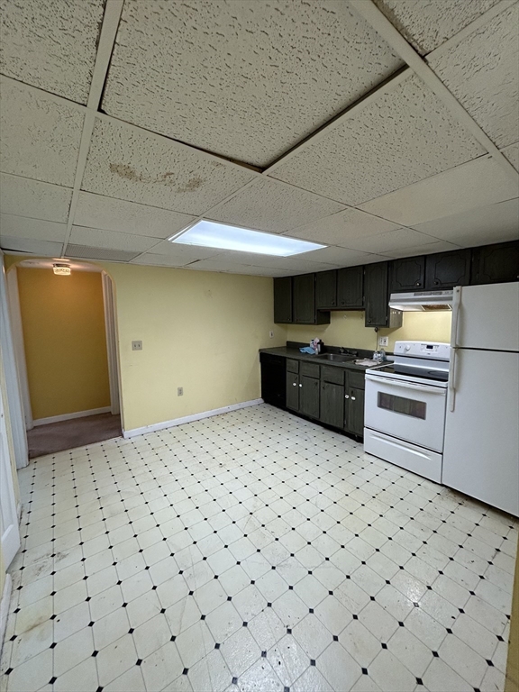 6 Shadowbrook Lane, Unit 9 Milford, MA 01757 - Photo 4 of 14 a kitchen with a sink and cabinets