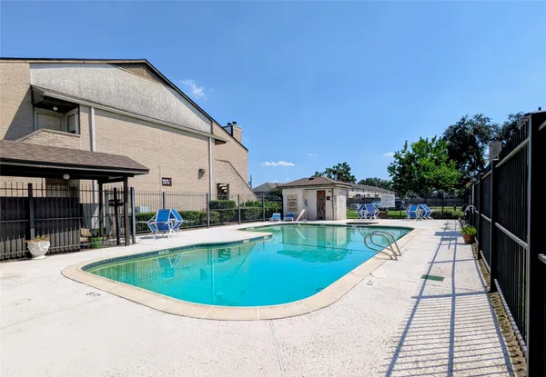 a view of a house with a swimming pool