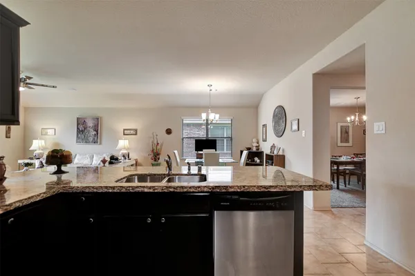 a kitchen with counter top space and sink