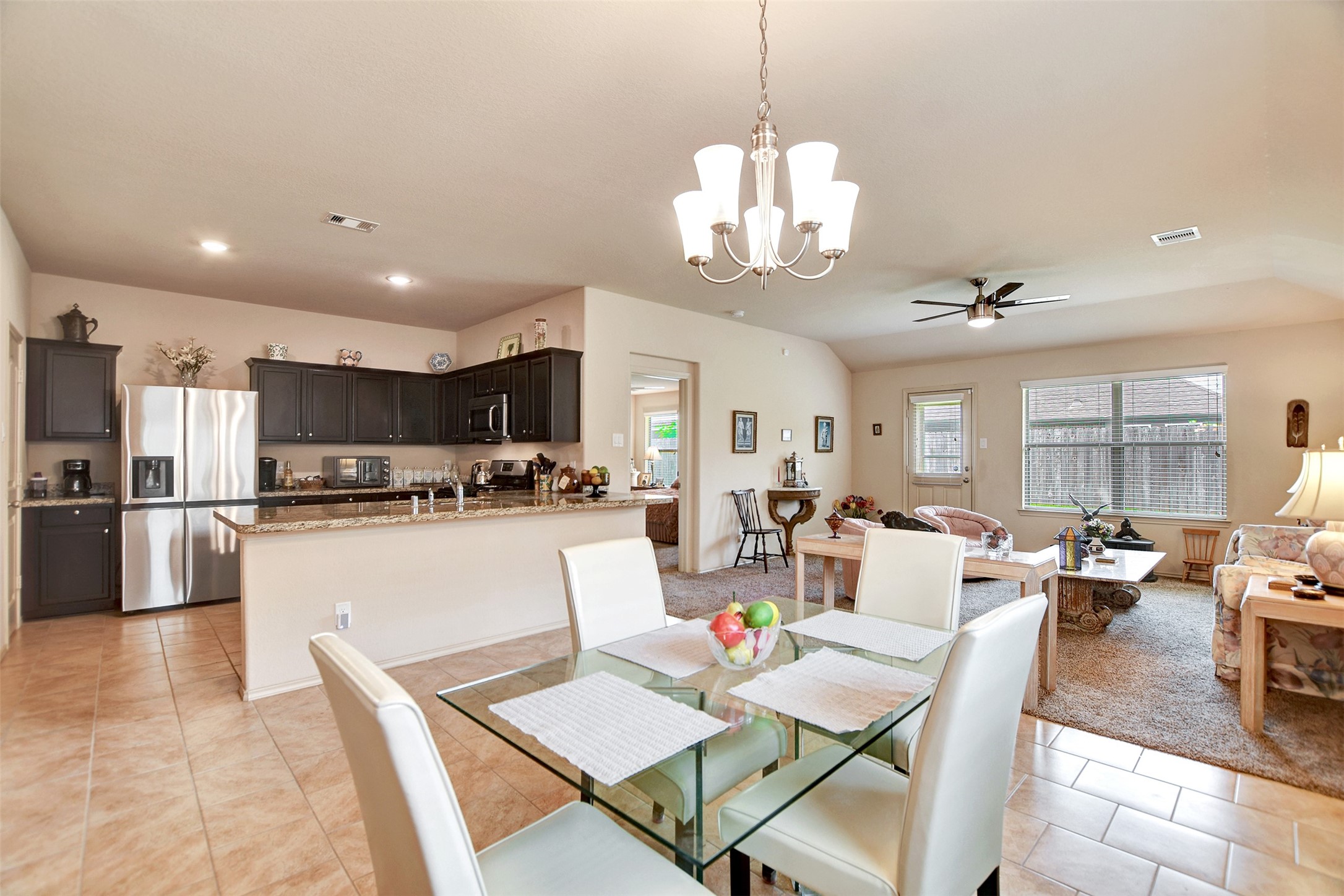 23314 Sawmill Pass Spring, TX 77373 - Photo 19 of 41 a large kitchen with a table and chairs