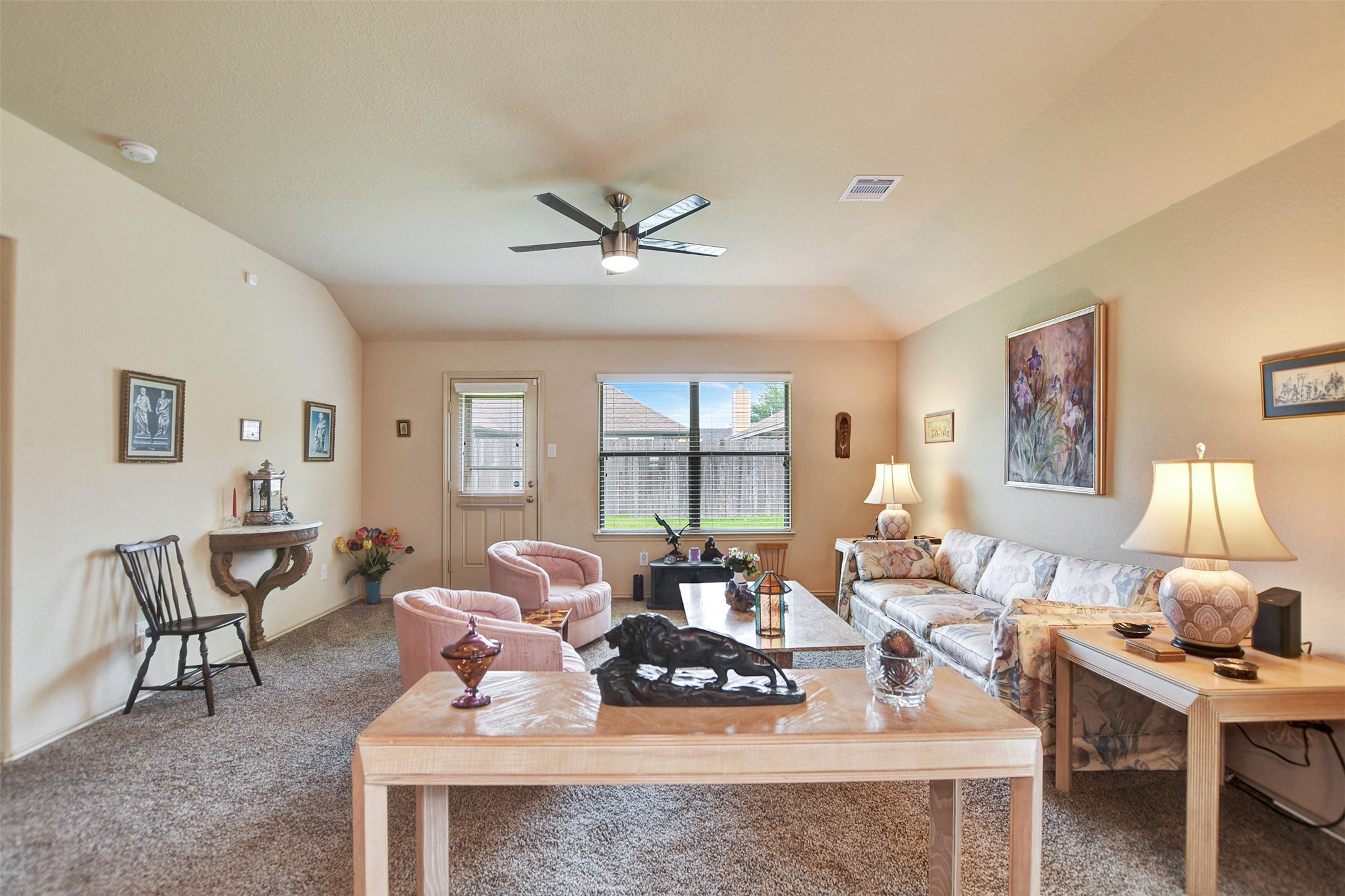23314 Sawmill Pass Spring, TX 77373 - Photo 20 of 41 a living room with furniture a table and a large window