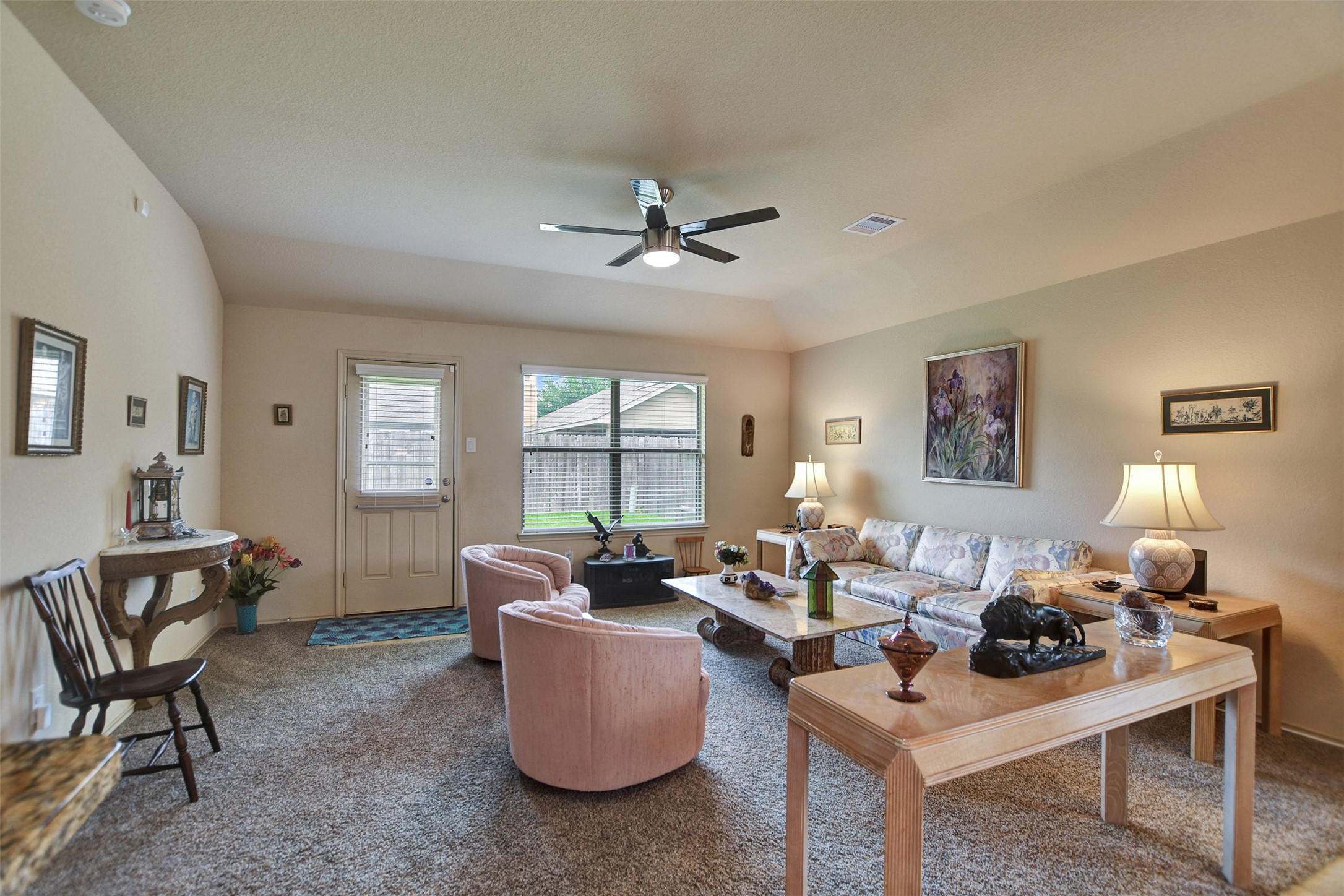 23314 Sawmill Pass Spring, TX 77373 - Photo 21 of 41 a living room with furniture a large window and a chandelier