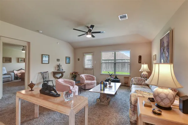 a living room with furniture and a window