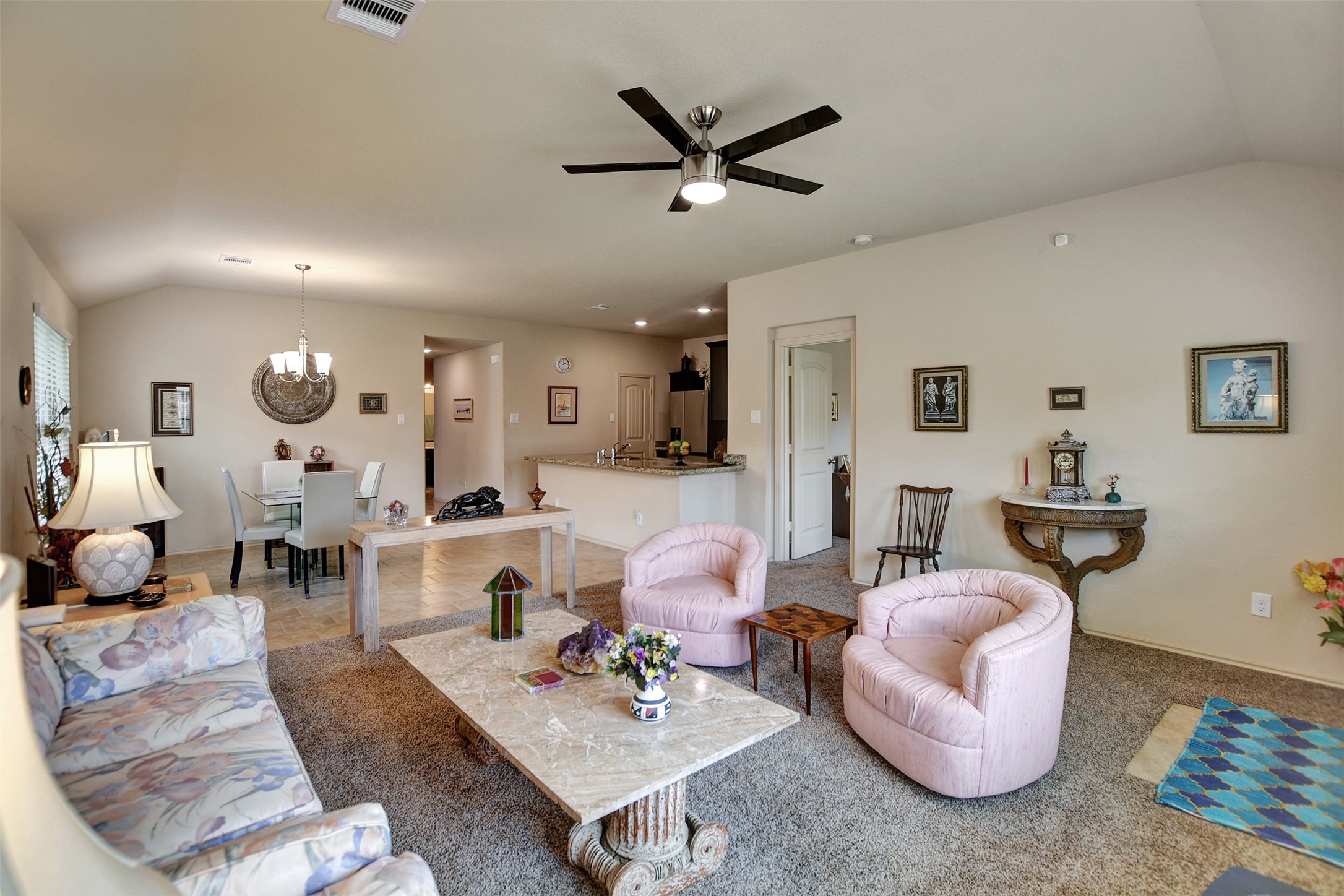 23314 Sawmill Pass Spring, TX 77373 - Photo 24 of 41 a living room with furniture kitchen view and a wooden floor