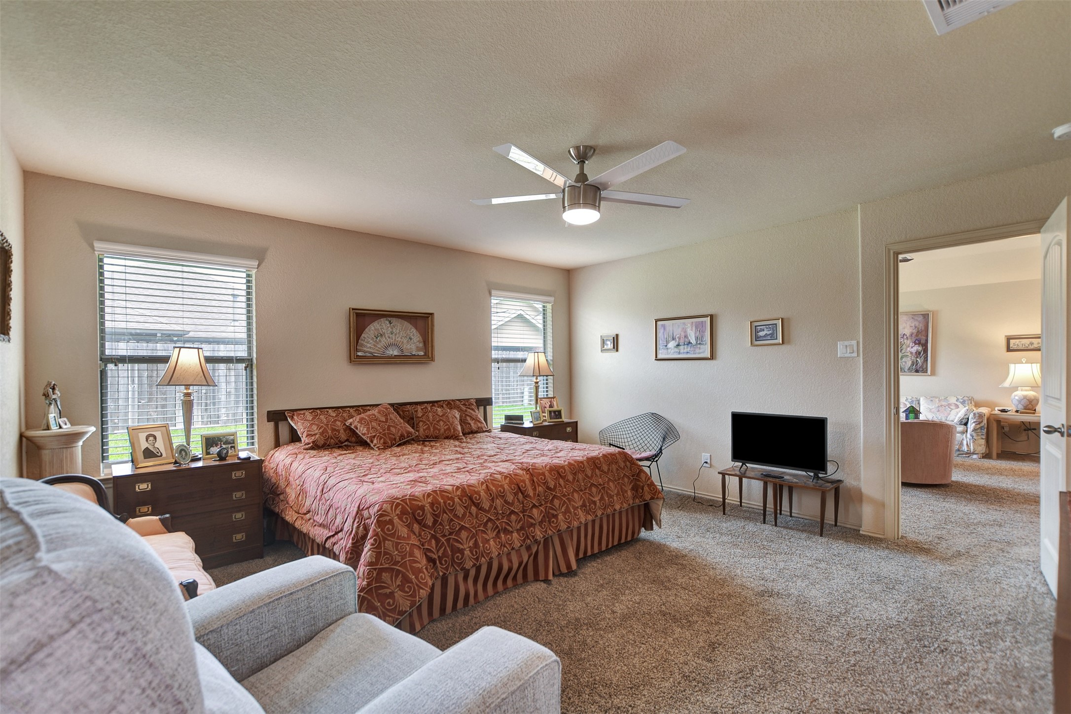 23314 Sawmill Pass Spring, TX 77373 - Photo 26 of 41 a bedroom with a large bed and a fireplace