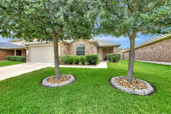 a house with garden in front of it