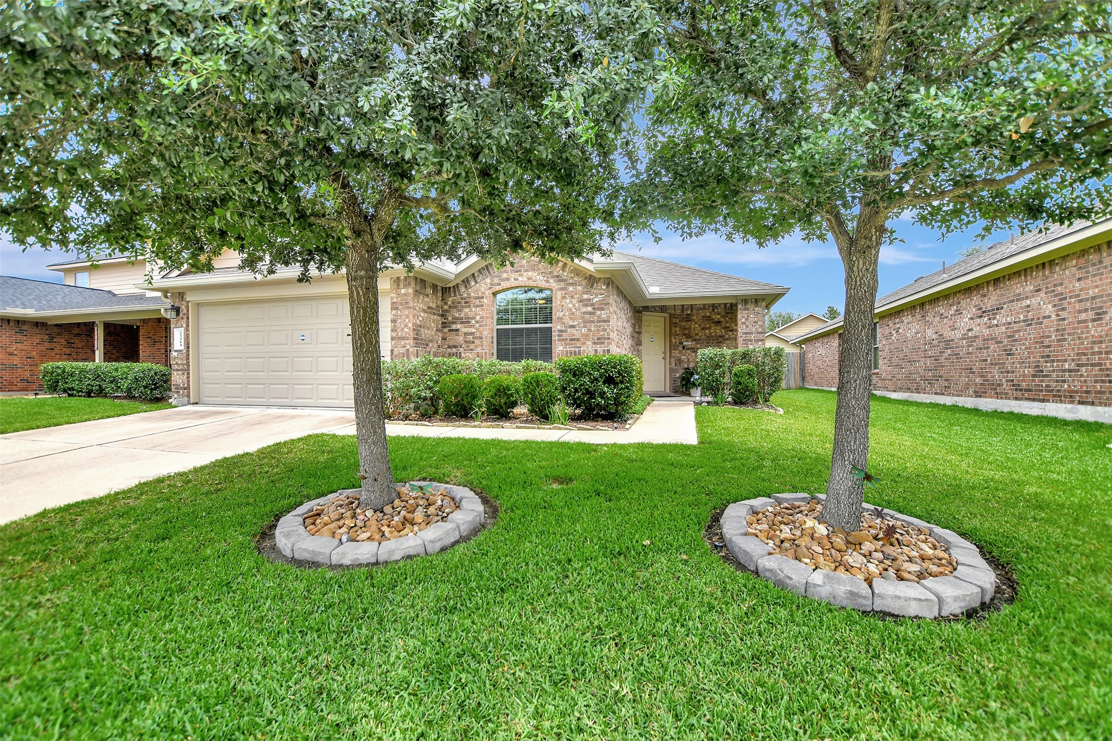 23314 Sawmill Pass Spring, TX 77373 - Photo 3 of 41 a house with garden in front of it