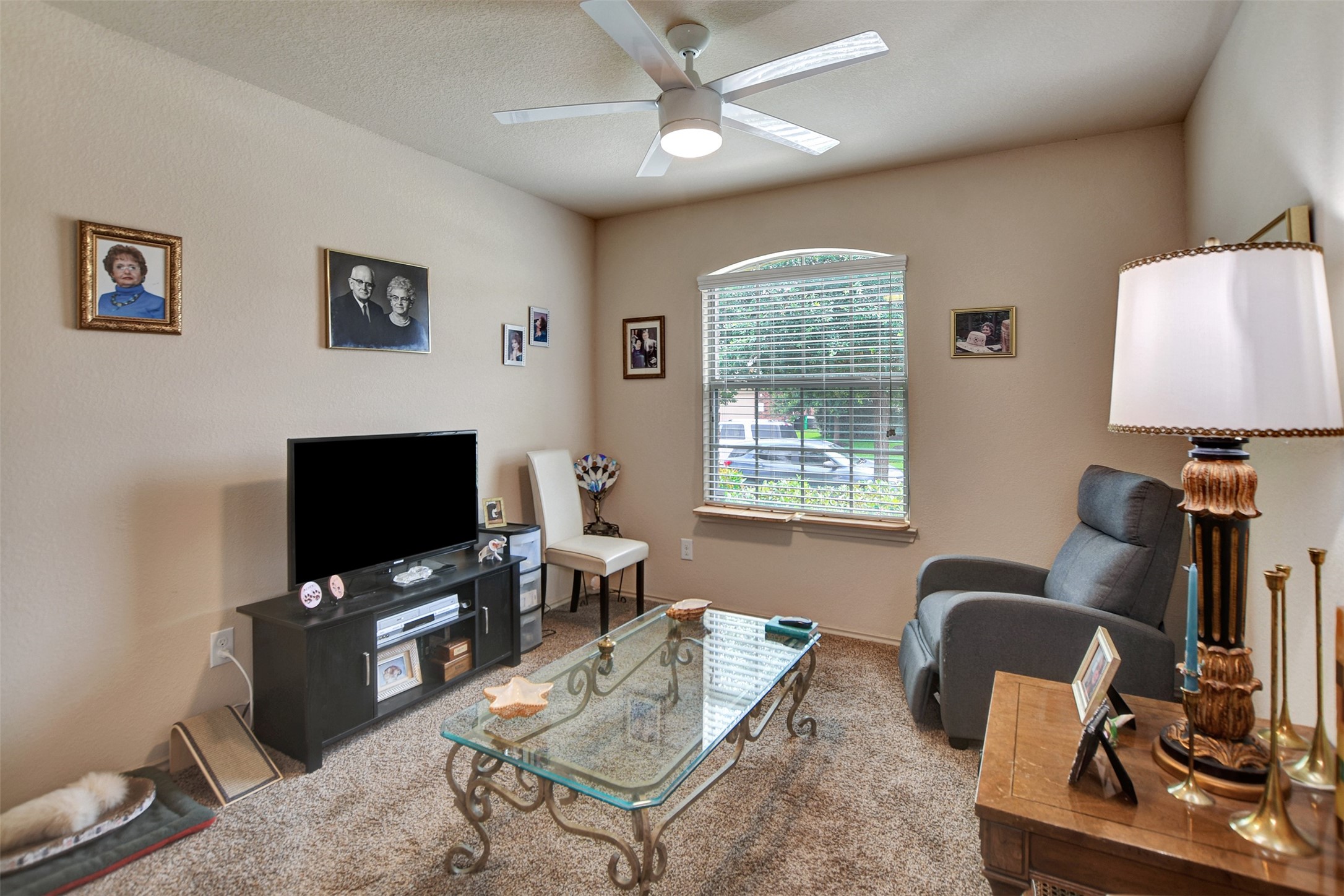 23314 Sawmill Pass Spring, TX 77373 - Photo 33 of 41 a living room with furniture and a flat screen tv